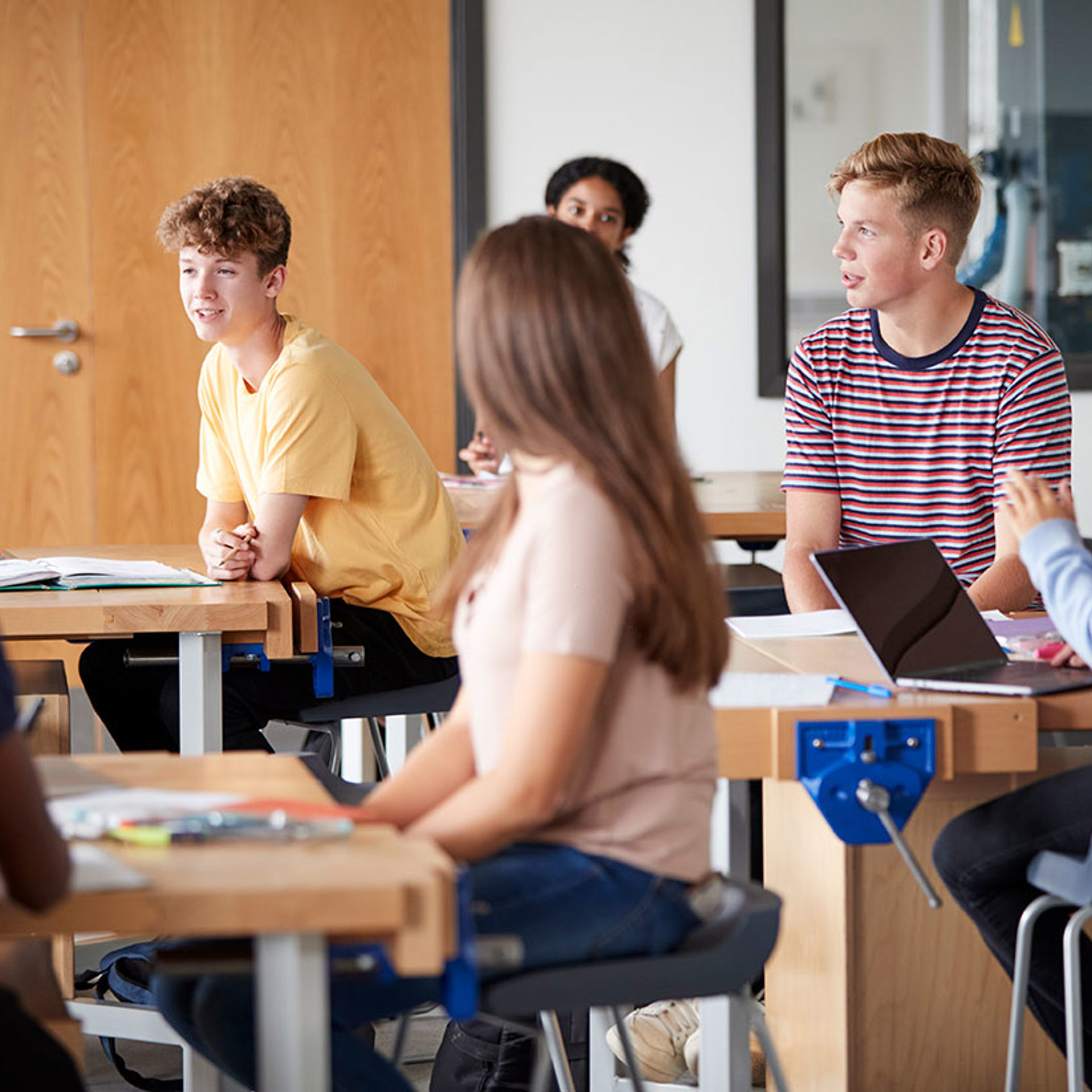 29402181 Group Of High School Students Sitting At Work Benches