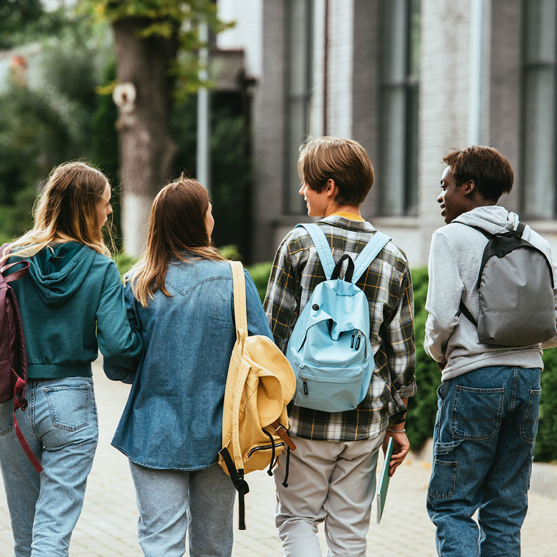 42823854 Back View Of Multiethnic Teenagers With Backpacks